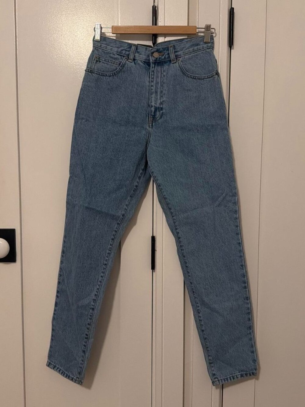 High-waisted blue denim jeans with a relaxed fit